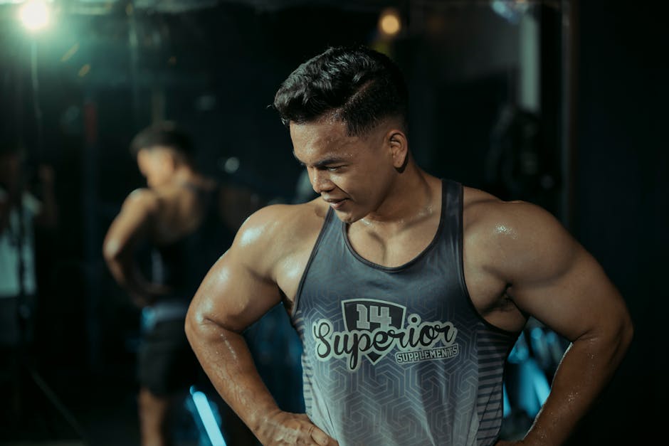 Muscular man in gym showing strength and determination.
