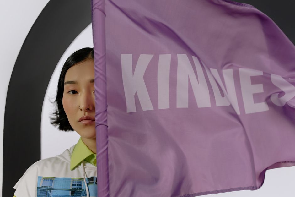 Asian woman partially obscured by a lavender 